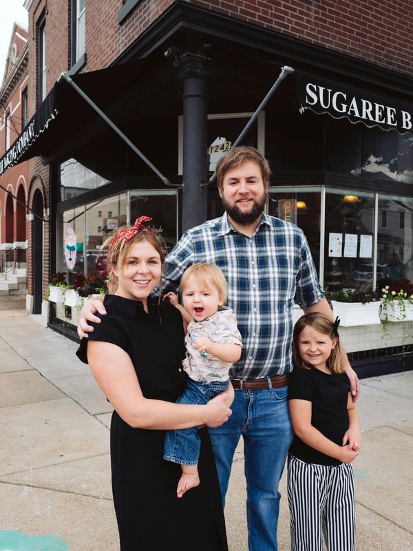 Pictures of new owners and their family before the grand reopening the Sugaree Baking Company.