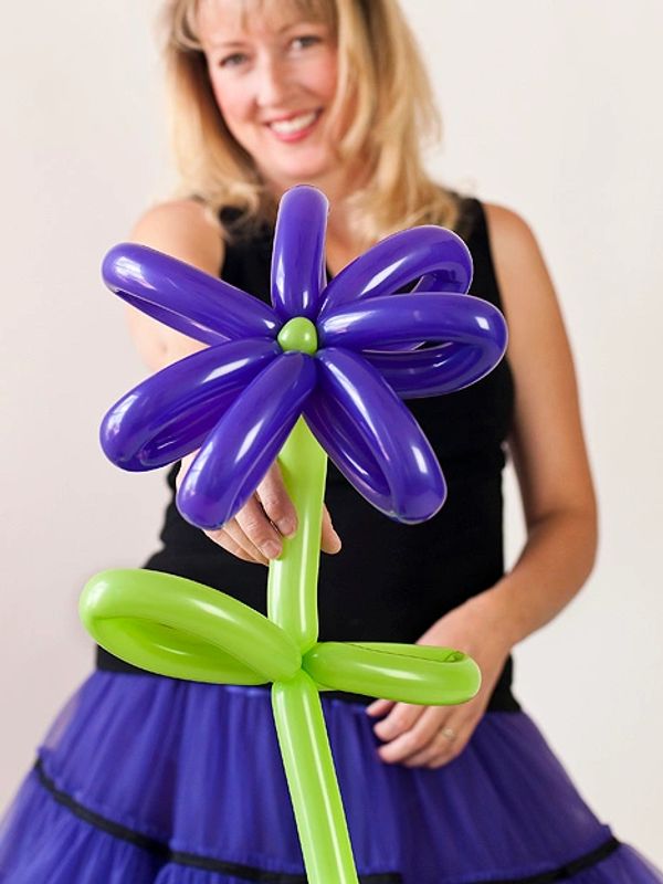 Tobi McJunkin holding a balloon flower