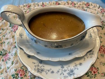 Gravy in a floral patterned gravy boat.