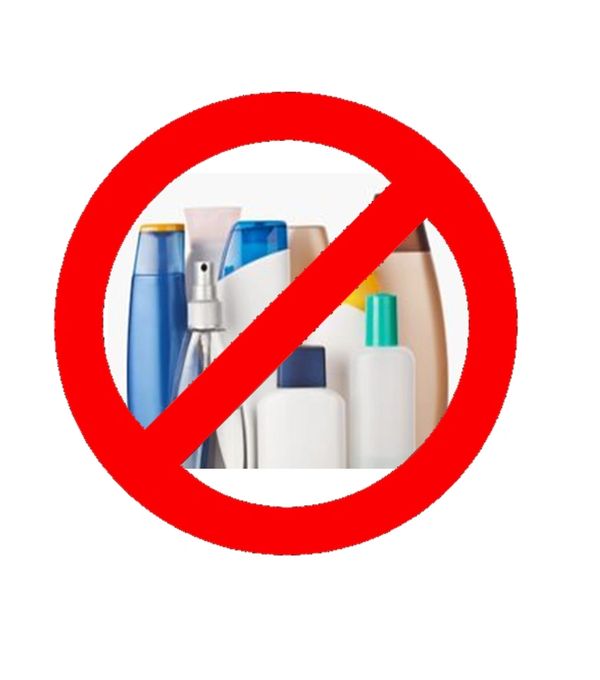 Large red rim circle with crossed out line across with bottles of scented products inside the circle