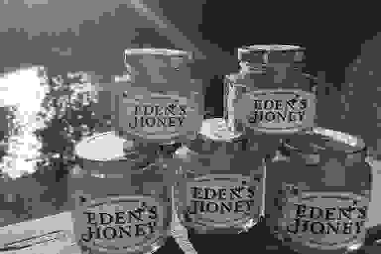 Eden's Honey jars setup with lovely Lake Chelan in the backdrop.