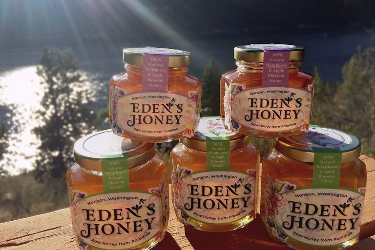 Eden's Honey jars setup with lovely Lake Chelan in the backdrop.