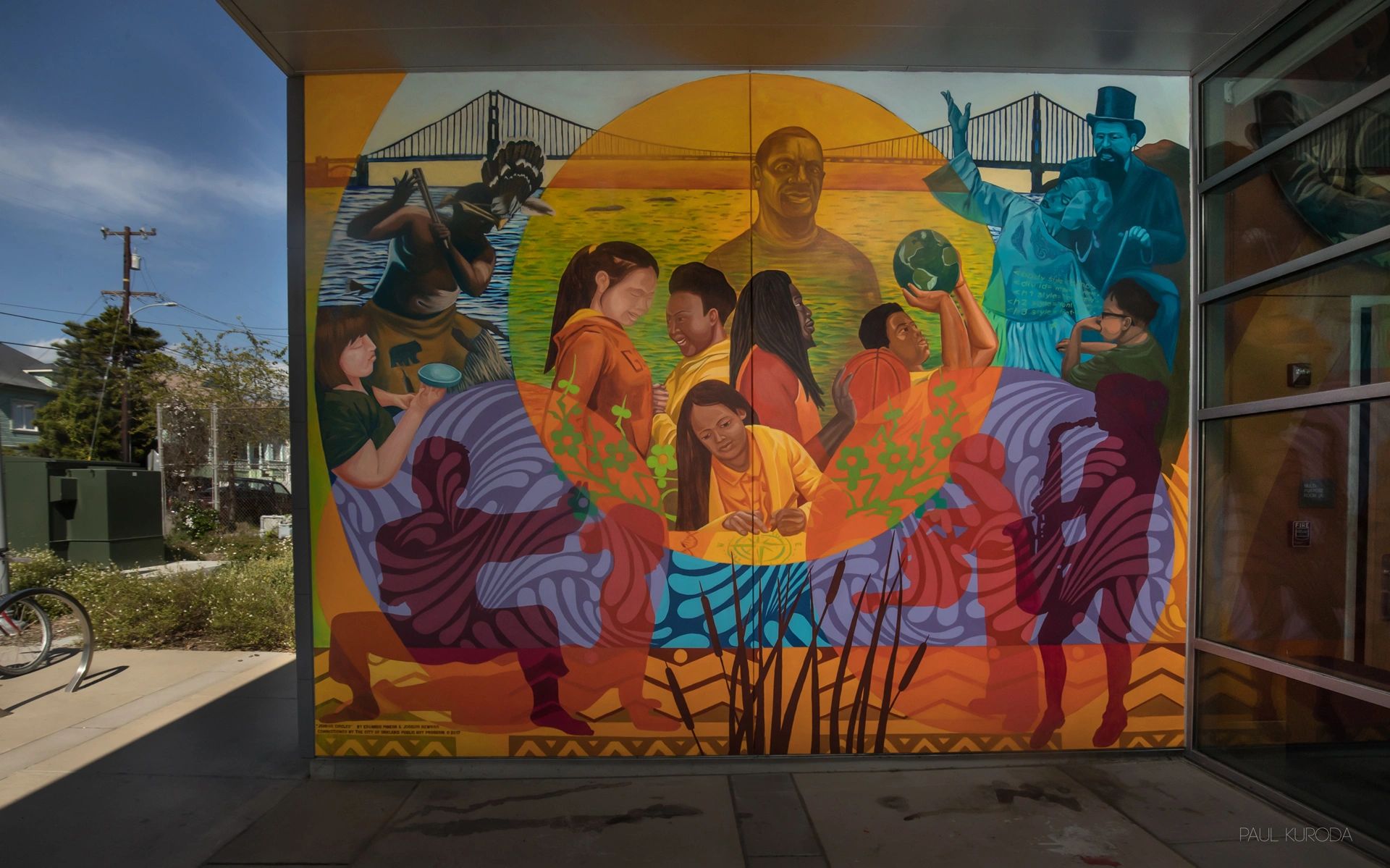 Youth and historic figures painted on vibrant mural at entrance to Recreation Center in Oakland, CA.