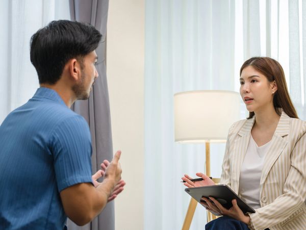 Man and woman in a meeting.