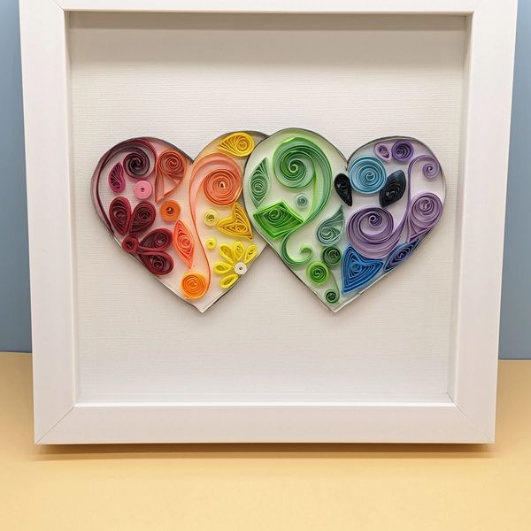 Ancient art form of Paper Quilling in heart shapes.