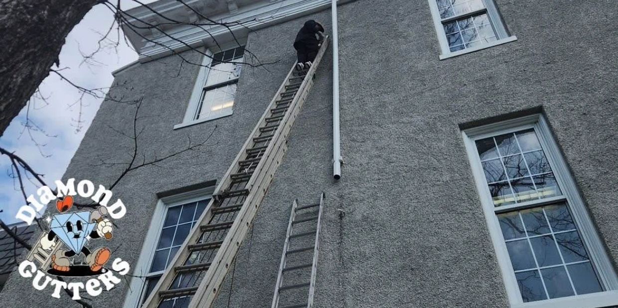 Commercial downspout replacement by Diamond Gutters LLC on a school building in Washington DC.
