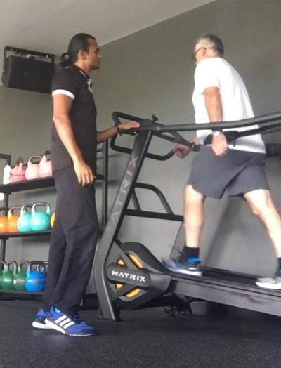 Walking on a treadmill for posture correction therapy. Improving walking gait - Recovery Fitness & r