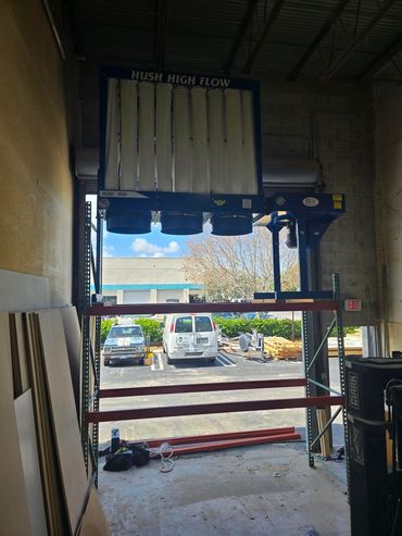 Elevated Dust Tech dust collection system installation in a South Florida woodworking shop.