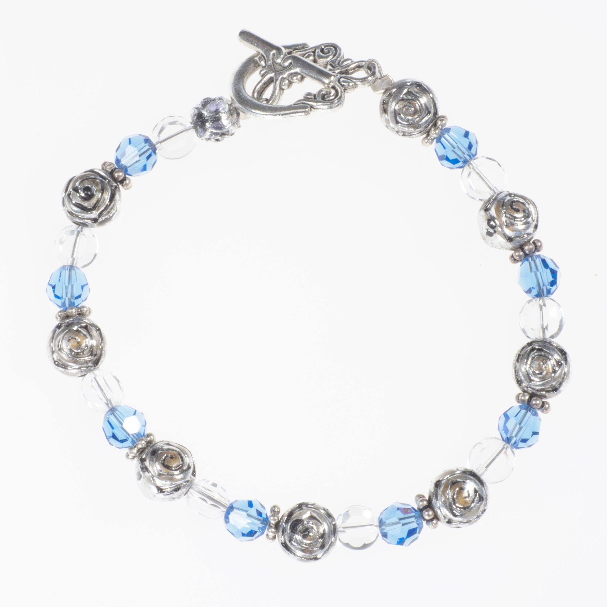 Bracele has Swarovski sapphire crystals,silver beads, round clear beads,silver spacers,toggle clasp
