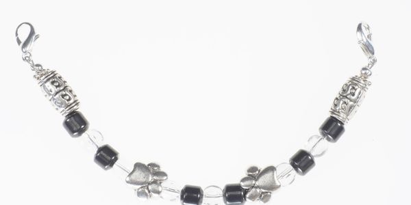 This medical bracelet has 2 antique silver-plated Dog Paws. It clasps to your medical ID tag.