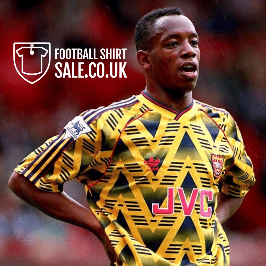 Ian Wright wearing a Arsenal Football Club 1991/93 banana away shirt