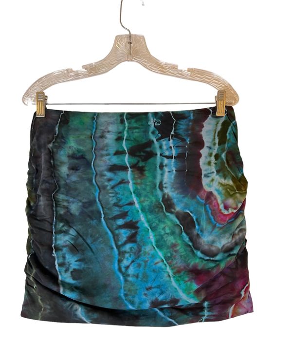 Tie dyed skirt with blue, green, and black patterns