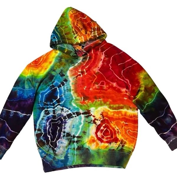 Comfy tie dyed hoodie with vibrant rainbow patterns including red, yellow, green, blue, and purple.