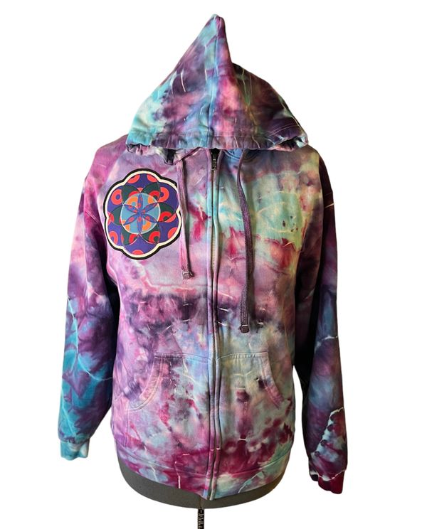 Tie dye hoodie with purple, blue, and pink patterns and a unique patch design