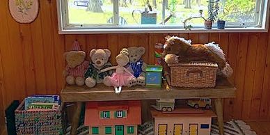 Books and toys with a fall back drop out the large window at The Cabin.