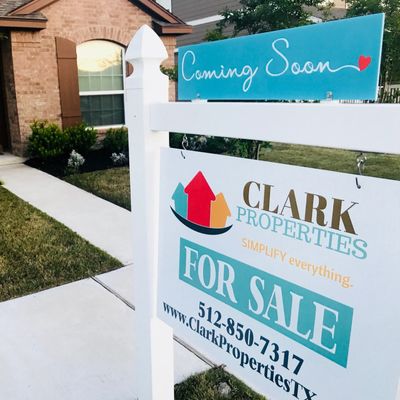 Clark Properties coming soon sign and sale sign in front of a home in Pflugerville, TX.