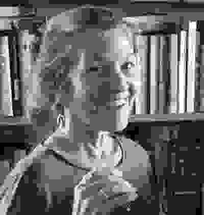 Image of lady smiling. It is Ann Harth, author of children's book and structural editor.