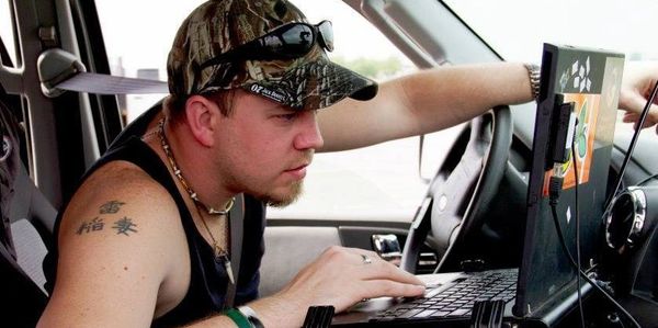 Adam Lucio looking over data while in the field storm chasing.