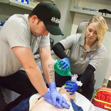 Emergency Medical Science students practicing resuscitation on a mannequin