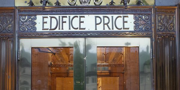 Shop doors with Edifice Price above them. Photo by Peter McCarey