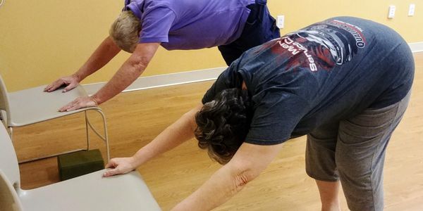 seniors doing yoga exercises