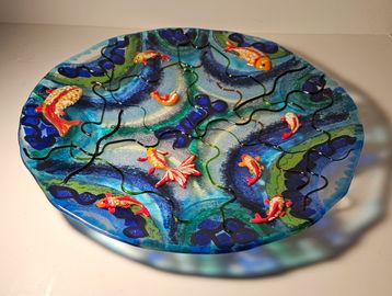 My latest foray into fused glass has been to incorporate tiny glass powder sculptures onto plates, p