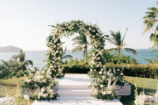 Lush white and green floral arch at Villa del Oso in Sayulita, Mexico
