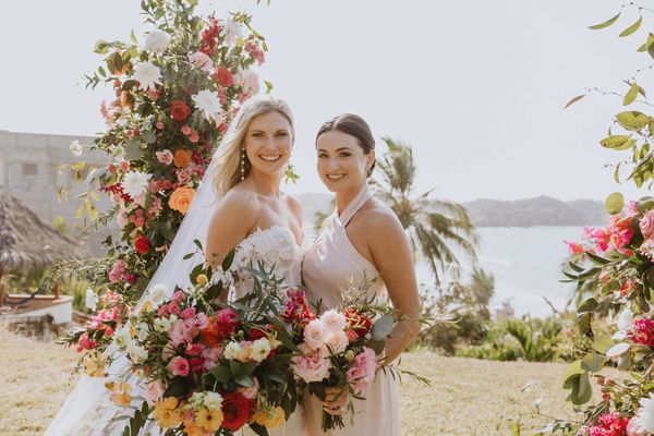 Ocean side tropical wedding at Villa del Oso in Sayulita, Mexico. Beautiful bridal bouquet and arch