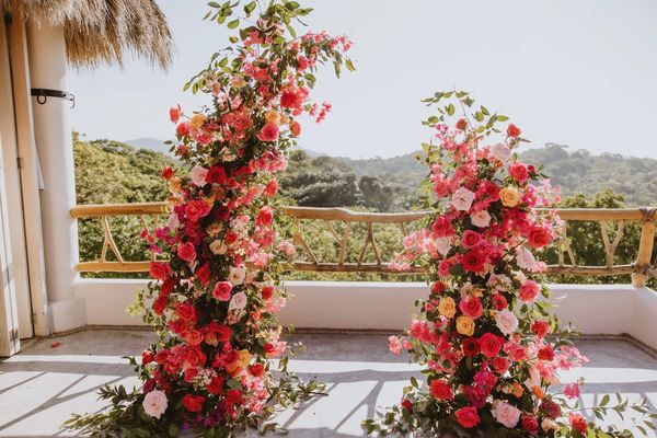 Bright pink and orange wedding ceremony. Modern and stylish floral design