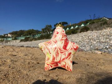 Star ceramic bauble made at Craftsea Paint Your Own Pottery Studio in Mumbles Swansea