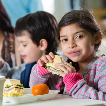 Girl enjoying food after treatment with desensititation
