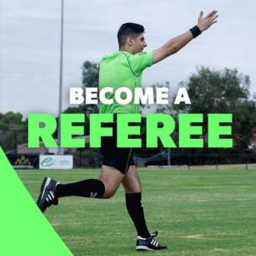 A soccer referee on the field signaling with his arm, promoting referee recruitment.