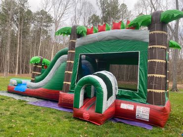 This tropical combo unit can be wet or dry! It has a ball hoop, a bounce area, and a slide! 