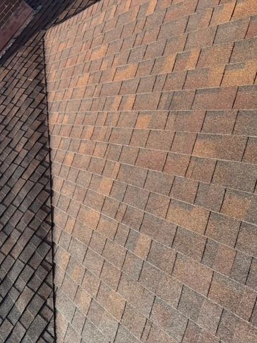 Close-up of brown and gray roof shingles.