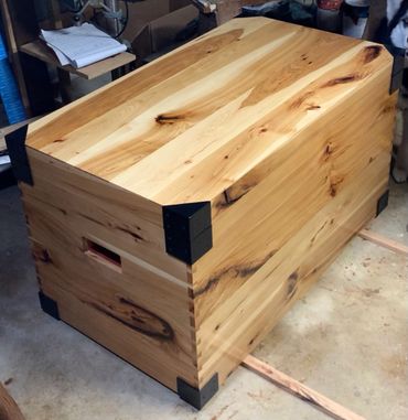 Hickory chest with dovetails and metal brackets.
