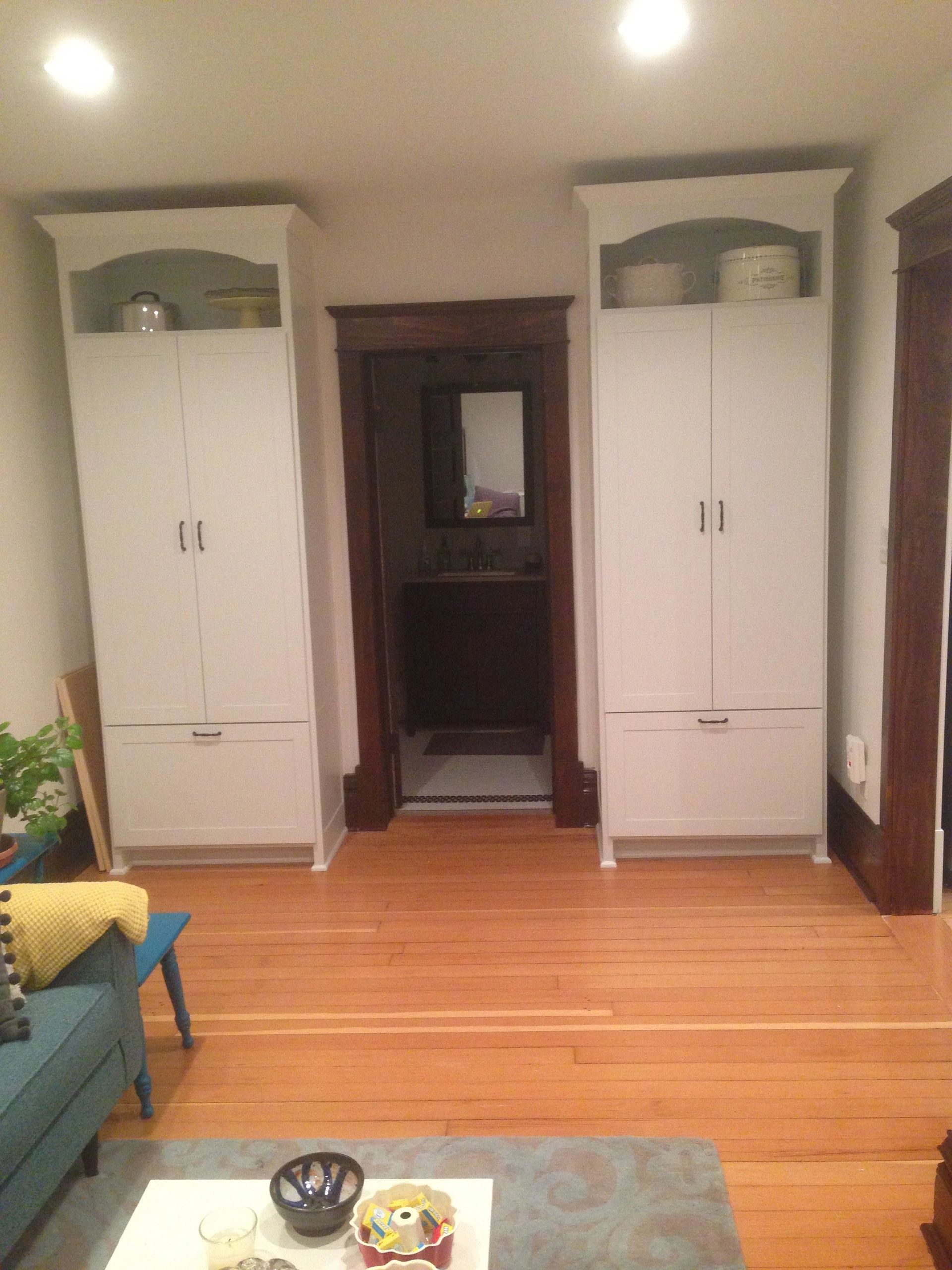 Custom pantry cabinets with drawers and white paint.