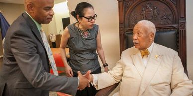 RunDND Director Laura Hart narrates Mayor Dinkins' 92nd birthday celebration at the MBP's office.