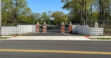 Brick pillars with custom pre-cast stone finials