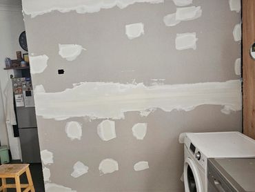 Drywall in progress—prepped and ready for a flawless finish in this laundry space
