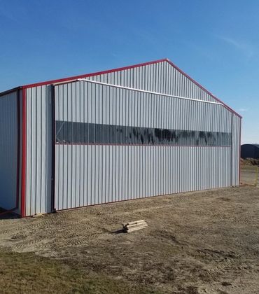 Diamond Bi-Fold Door with a see through panel on an Agricultural Application