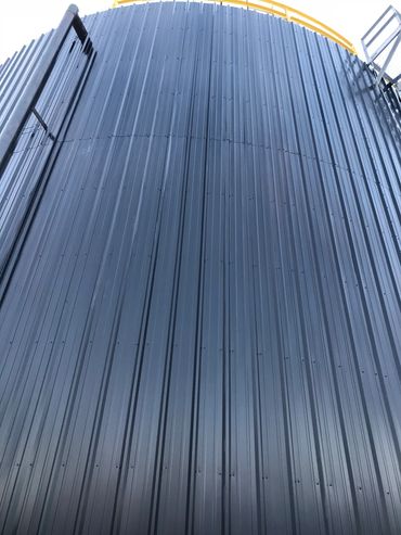Close-up of a metal industrial storage tank.