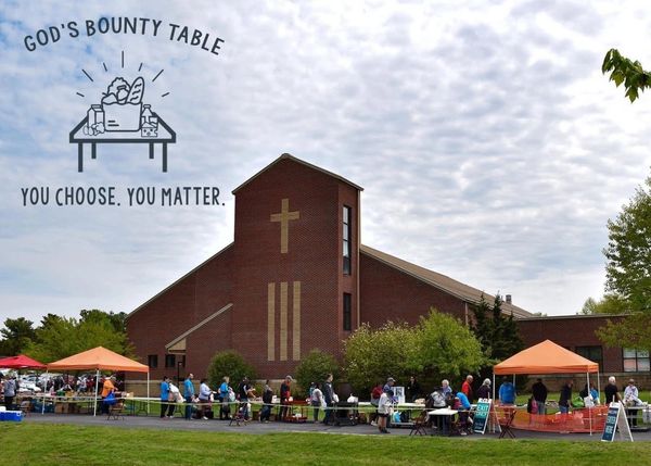 People lined up outside a church for God's Bounty Table event.