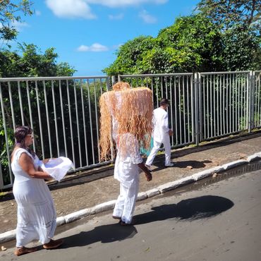 Heading to a celebration in honor of the Orisha, Omolu.