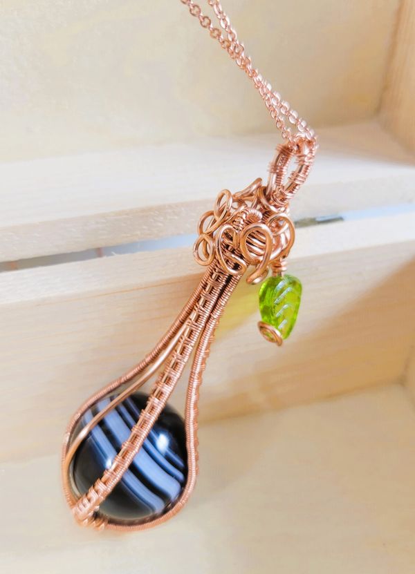Discover the Orb Collection, featuring 20mm sphere gemstones, each carefully wire wrapped in copper.