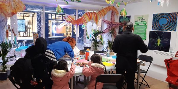 families enjoy arts and crafts at the green light shop in Nottingham