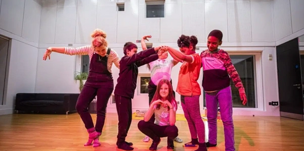 a group of young actors pose for the camera