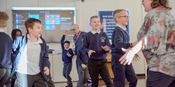 schoolboys running and playing