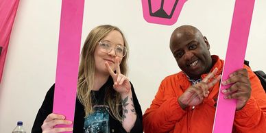 two people giving peace signs