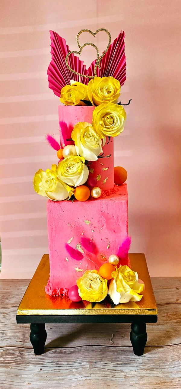 2 tier pink cake with roses