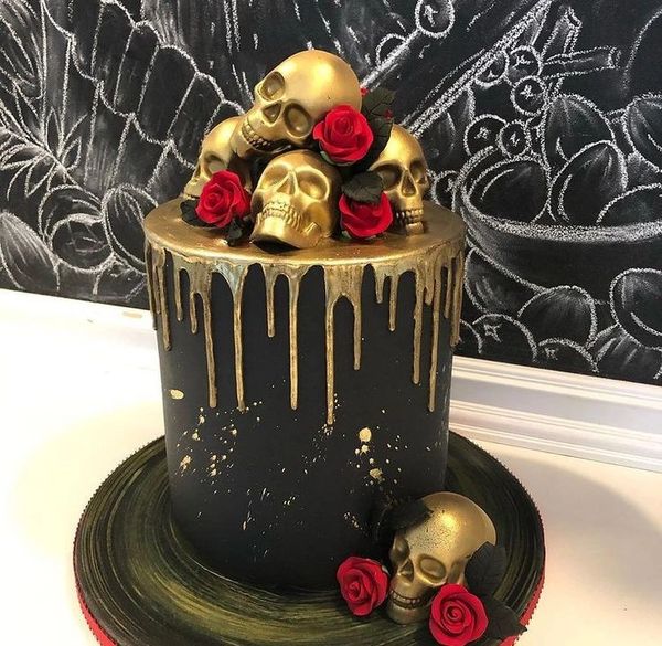 Black cake with skulls and gold drip